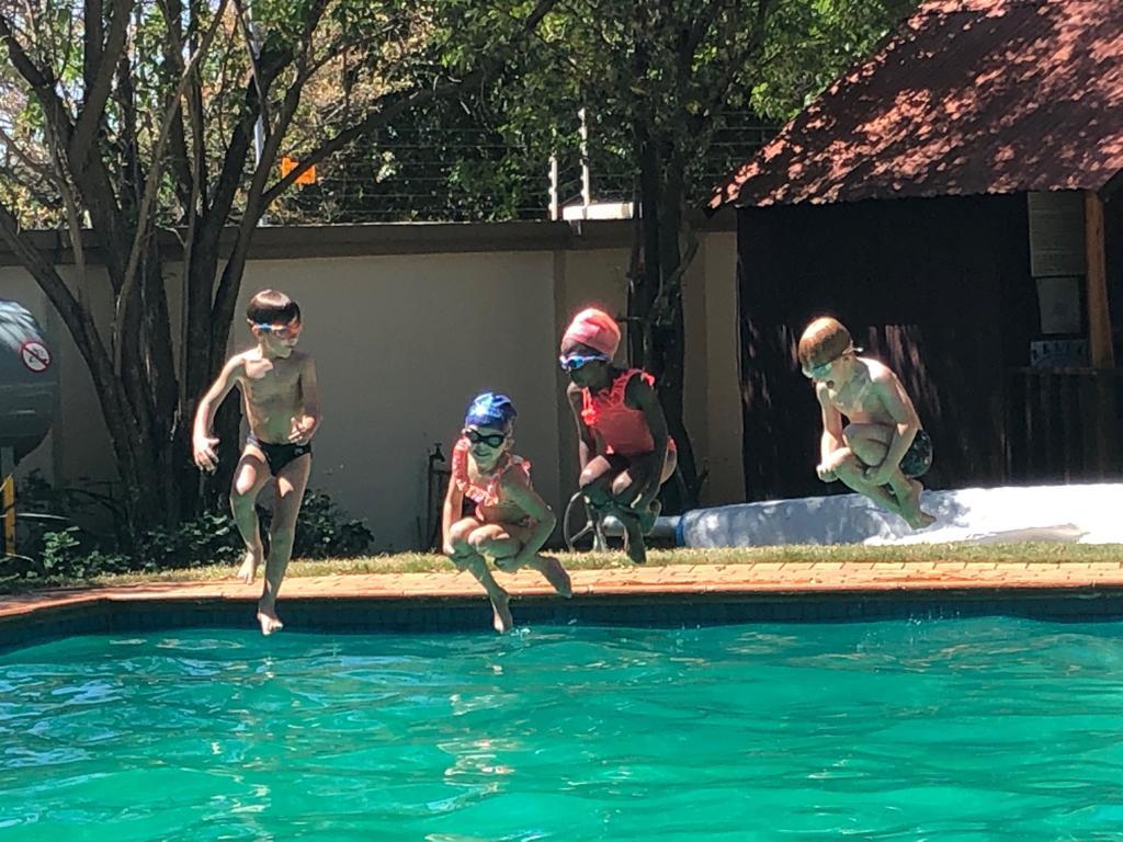Kids at pool edge